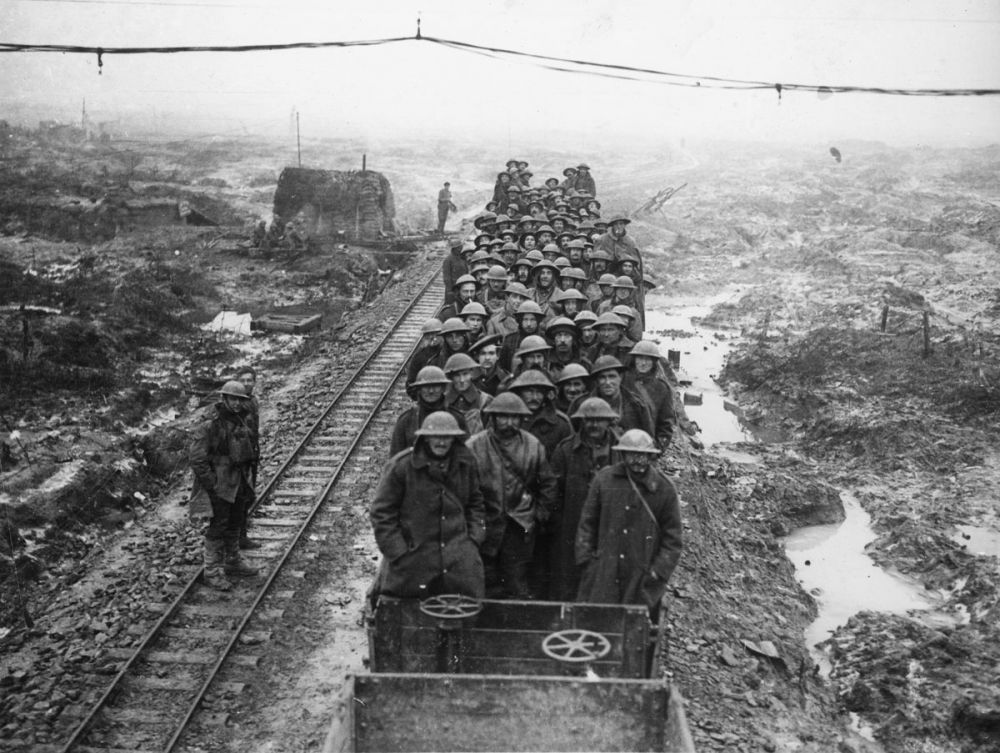 A working party of Royal Engineers coming down the line by light rail, Ypres, 7 January 1918.